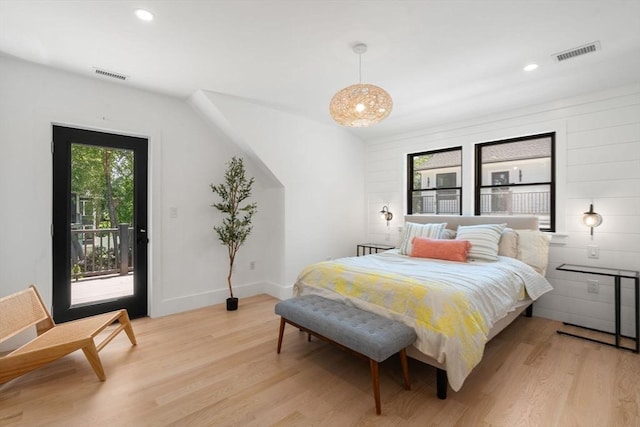 216 Aspinwall Ave, Brookline, MA 02446 - bedroom featuring light wood-type flooring, access to exterior, and recessed lighting
