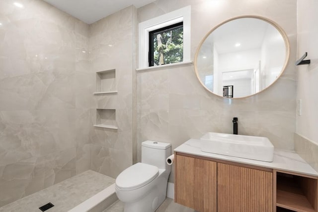 216 Aspinwall Ave, Brookline, MA 02446 - full bath featuring vanity, toilet, tile walls, and a tile shower