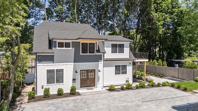 216 Aspinwall Ave, Brookline, MA 02446 - view of front of house featuring board and batten siding and a shingled roof