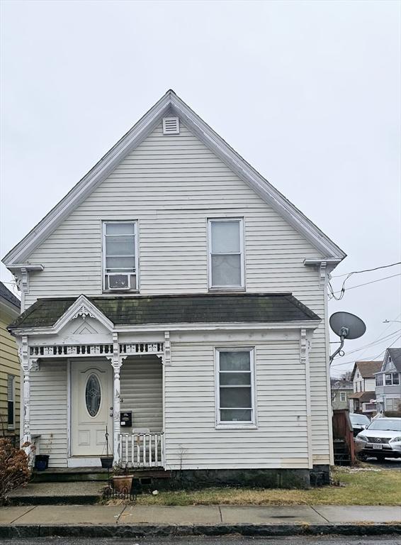 view of front of home with covered porch and cooling unit