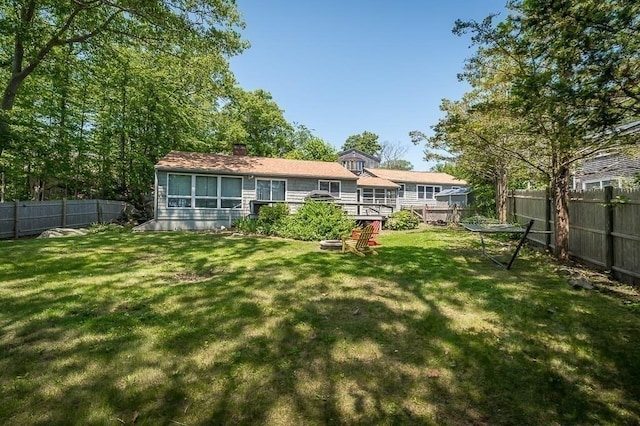3 Ridgewood Rd, Rockport, MA 01966 - back of property with a fenced backyard and a chimney