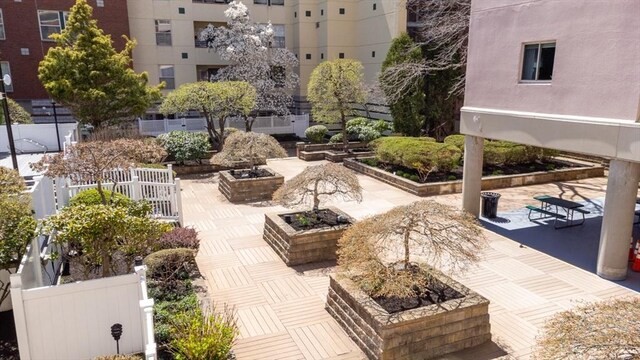 surrounding community with a patio and fence