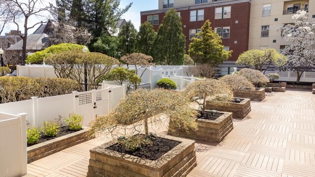 view of community featuring fence