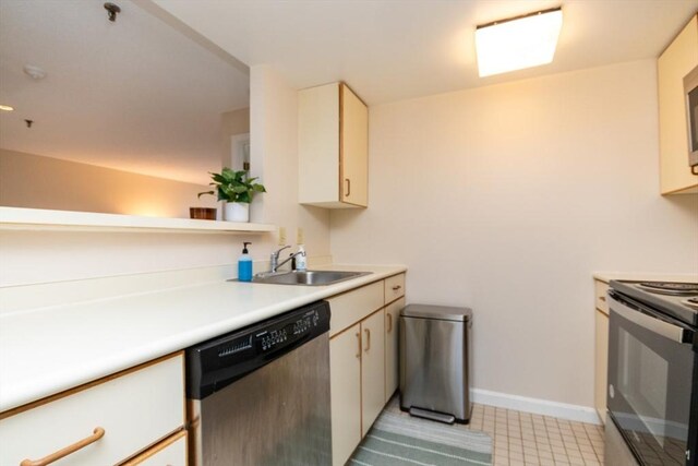 kitchen with baseboards, electric stove, light countertops, a sink, and dishwasher