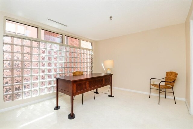 carpeted home office featuring baseboards and visible vents