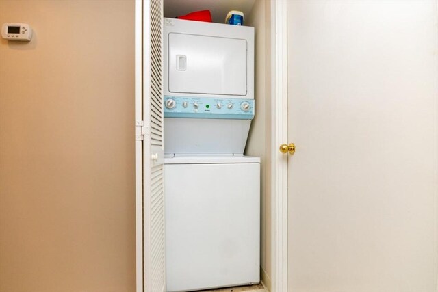 laundry area with laundry area and stacked washing maching and dryer
