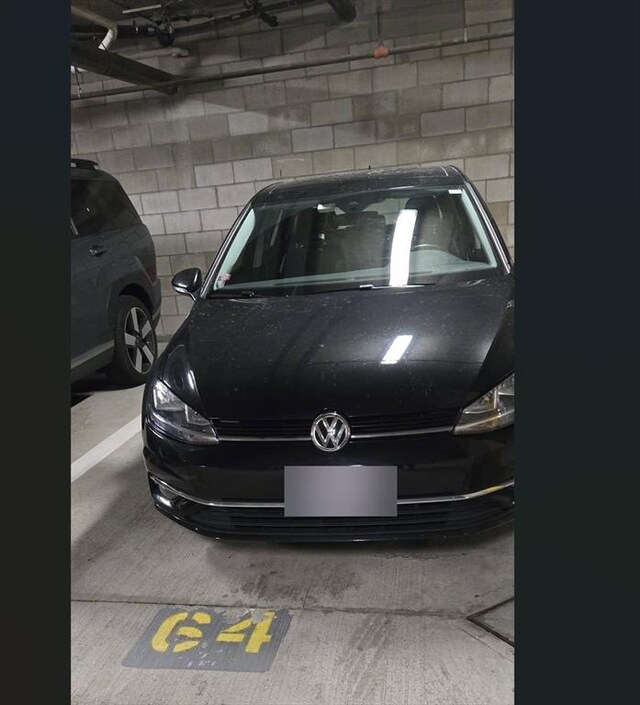 parking deck featuring concrete block wall
