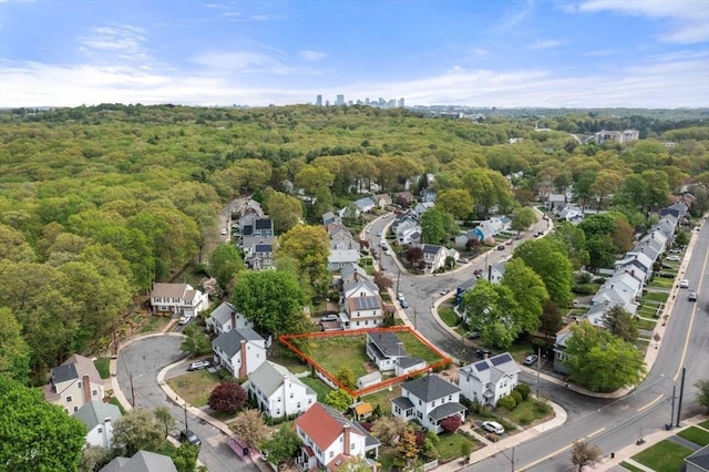 10 Gretter Rd, Boston, MA 02132 - aerial view of property and surrounding area with property boundaries highlighted, a heavily wooded area, and nearby suburban area