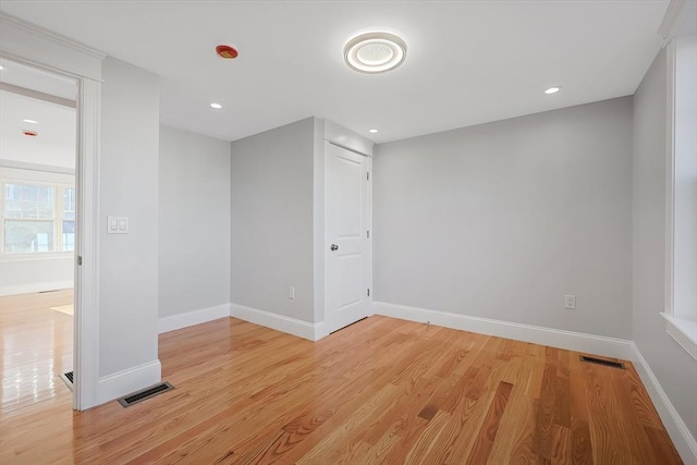 unfurnished room featuring light wood-type flooring