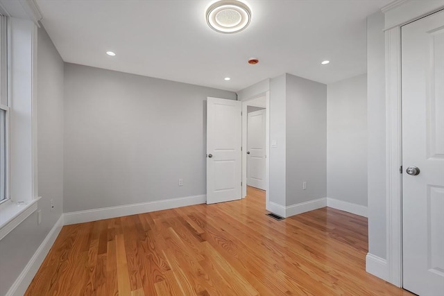 unfurnished bedroom with light wood-type flooring