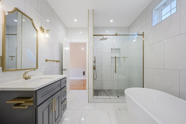 bathroom with vanity, tile walls, and plus walk in shower