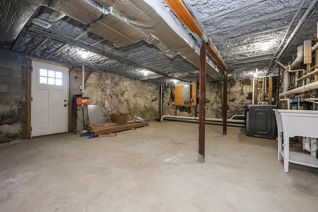 basement with washer / dryer and electric panel