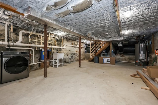 basement featuring washer / dryer, sink, and water heater