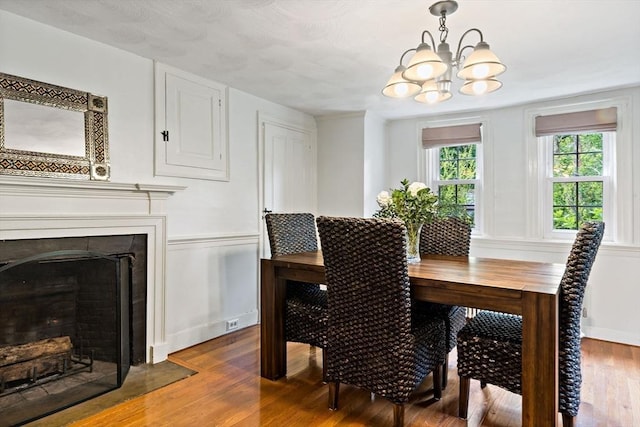 330 Fairview Ave, Rehoboth, MA 02769 - dining area featuring a chandelier, dark wood finished floors, and a fireplace with flush hearth