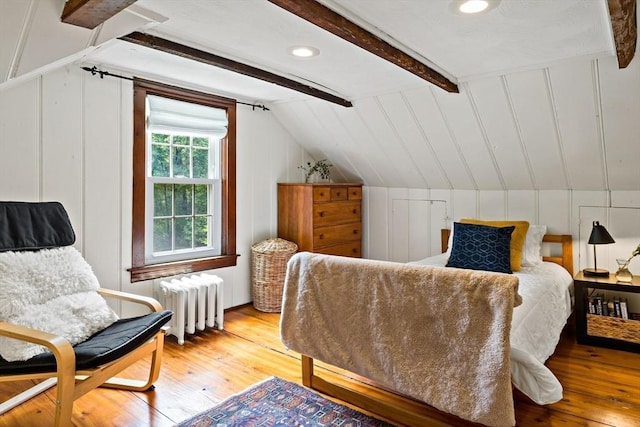 330 Fairview Ave, Rehoboth, MA 02769 - bedroom with radiator heating unit, hardwood / wood-style flooring, and a decorative wall
