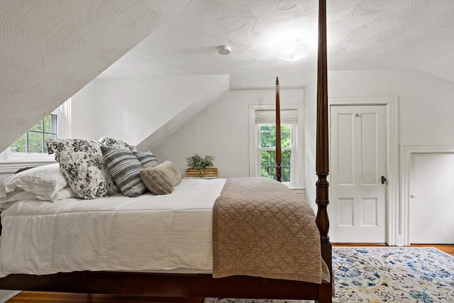 330 Fairview Ave, Rehoboth, MA 02769 - bedroom with lofted ceiling and wood finished floors