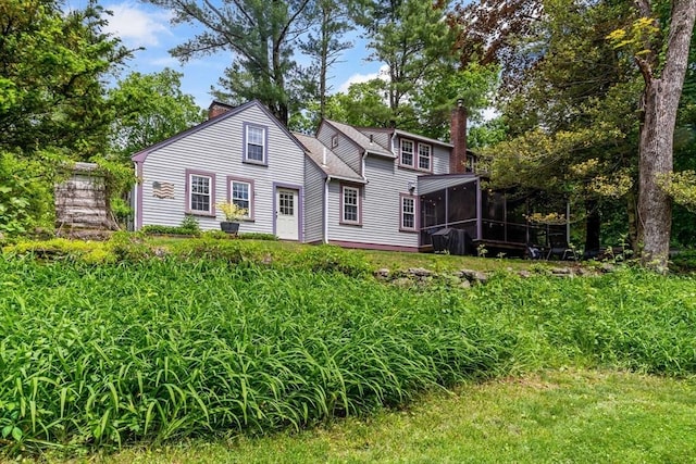 330 Fairview Ave, Rehoboth, MA 02769 - view of front of house with a chimney and a sunroom