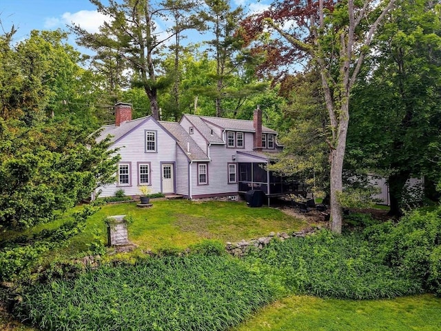 330 Fairview Ave, Rehoboth, MA 02769 - rear view of property with a chimney, a sunroom, and a lawn