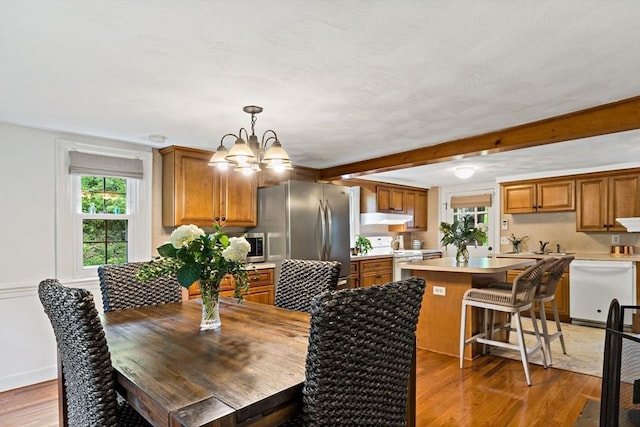 330 Fairview Ave, Rehoboth, MA 02769 - dining room featuring a chandelier, wood finished floors, and beamed ceiling