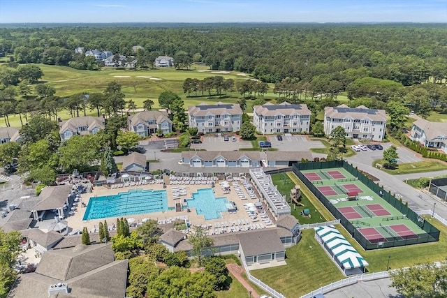 66 Simons Unit C, Mashpee, MA 02649 - bird's eye view of a pool area and a heavily wooded area