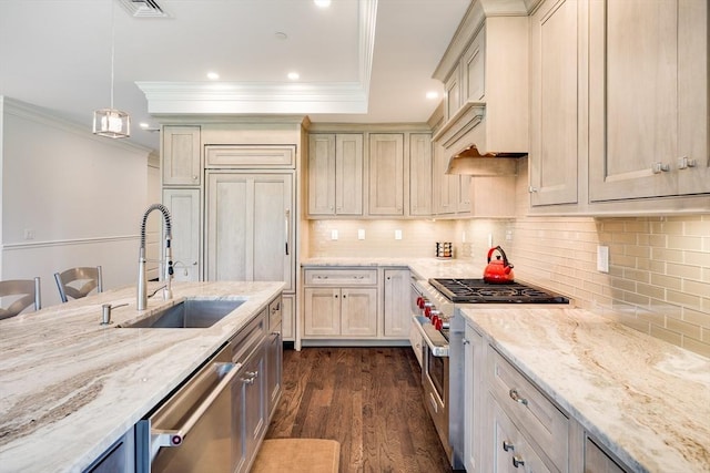 66 Simons Unit C, Mashpee, MA 02649 - kitchen featuring high end appliances, ornamental molding, dark wood finished floors, recessed lighting, and light stone countertops