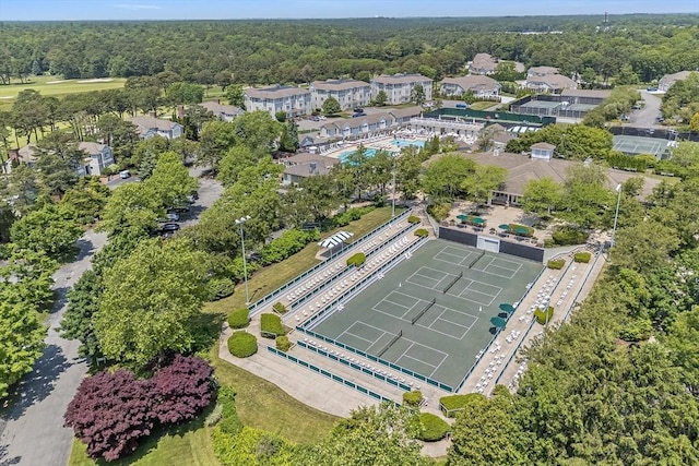 66 Simons Unit C, Mashpee, MA 02649 - aerial view of property and surrounding area featuring a pool and a forest