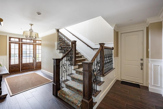 66 Simons Unit C, Mashpee, MA 02649 - entrance foyer with wood finished floors, stairway, a chandelier, a decorative wall, and a wainscoted wall