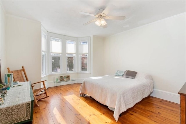 bedroom featuring ceiling fan and hardwood / wood-style floors