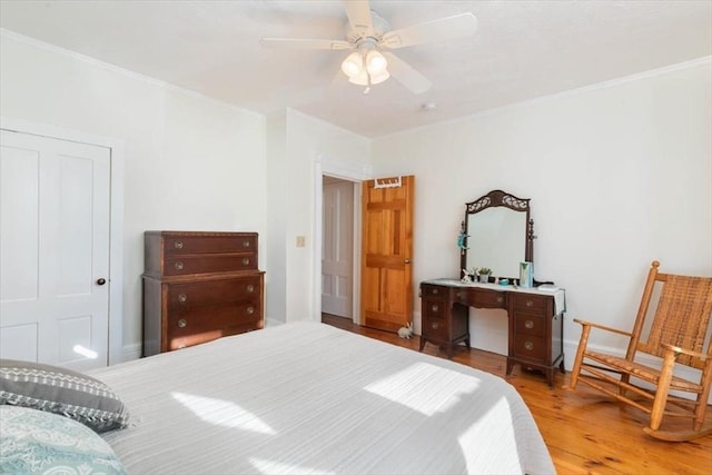 bedroom featuring hardwood / wood-style flooring and ceiling fan