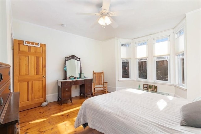 bedroom featuring ceiling fan and light hardwood / wood-style flooring