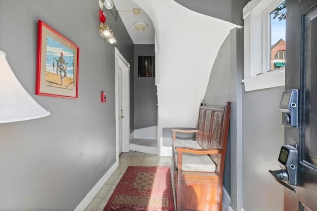 corridor featuring light tile patterned floors