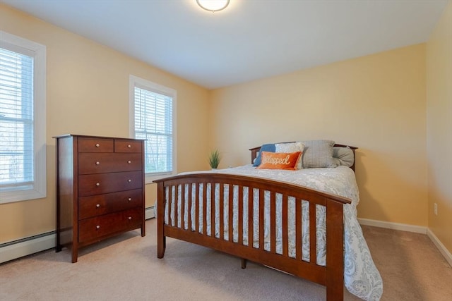 bedroom featuring carpet, baseboards, and baseboard heating