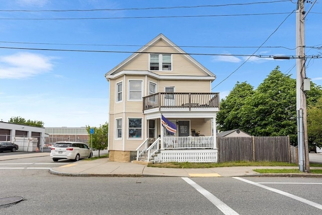 369-371 Mill St, New Bedford, MA 02740 - view of front of property with a balcony, a porch, and uncovered parking