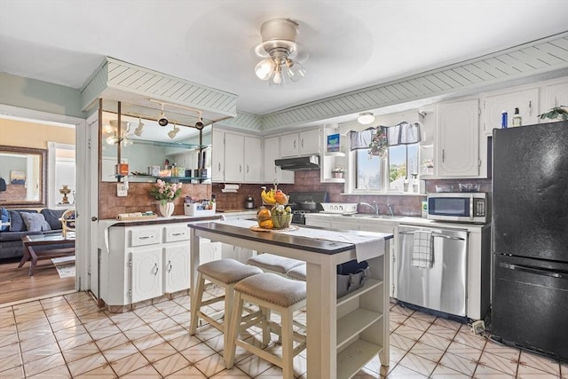 369-371 Mill St, New Bedford, MA 02740 - kitchen with appliances with stainless steel finishes, open shelves, under cabinet range hood, a ceiling fan, and white cabinets