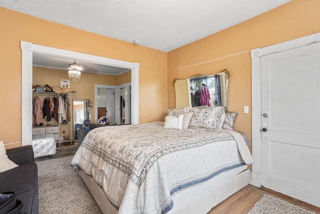369-371 Mill St, New Bedford, MA 02740 - bedroom featuring multiple windows, a closet, a chandelier, and wood finished floors
