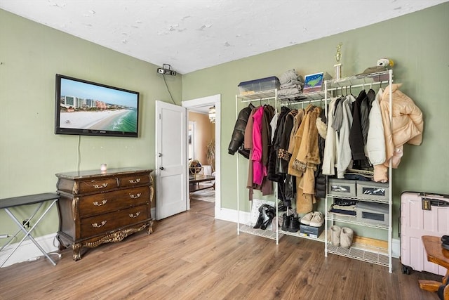 369-371 Mill St, New Bedford, MA 02740 - bedroom with wood finished floors, baseboards, and radiator