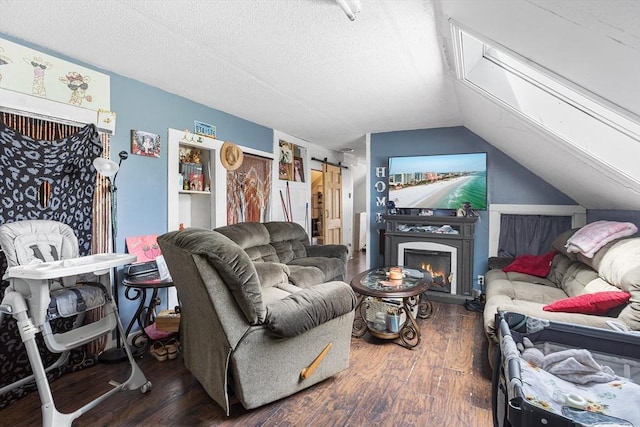 369-371 Mill St, New Bedford, MA 02740 - living area with lofted ceiling, wood finished floors, a textured ceiling, and a barn door