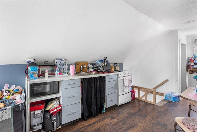 369-371 Mill St, New Bedford, MA 02740 - bar with vaulted ceiling, dark wood finished floors, black microwave, white electric stove, and a textured ceiling