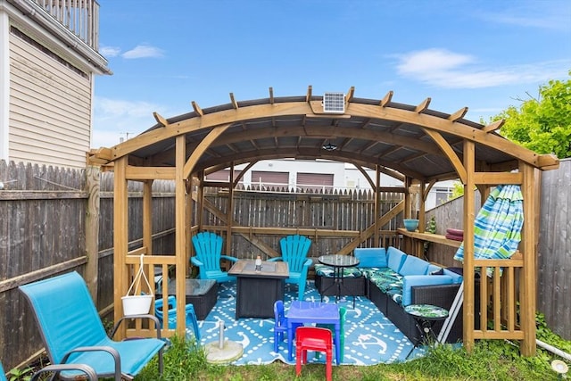 369-371 Mill St, New Bedford, MA 02740 - fenced backyard featuring an outdoor living space with a fire pit