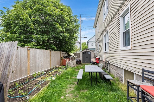 369-371 Mill St, New Bedford, MA 02740 - view of yard featuring a vegetable garden and outdoor dining area
