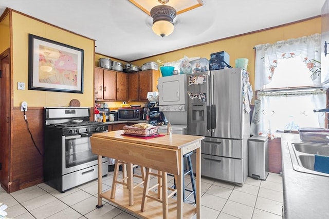 369-371 Mill St, New Bedford, MA 02740 - kitchen with stainless steel appliances, light tile patterned floors, and a sink