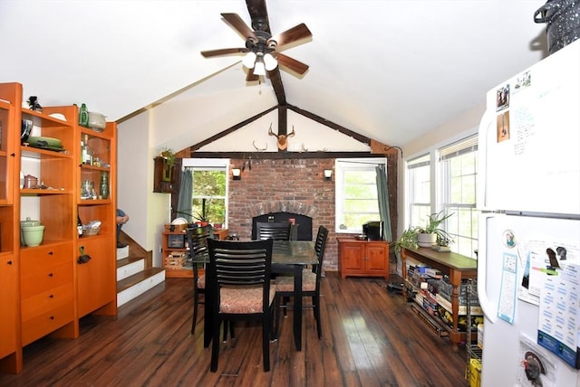 dining room featuring ceiling fan, dark wood finished floors, and lofted ceiling