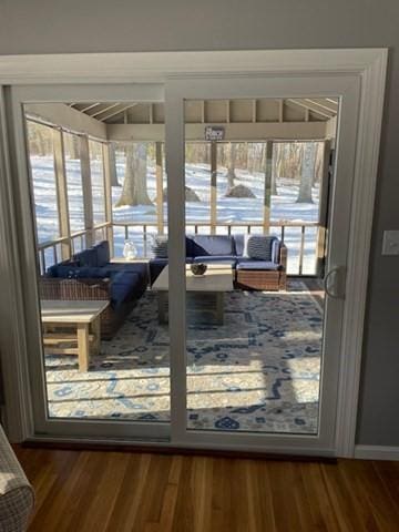 doorway featuring wood finished floors