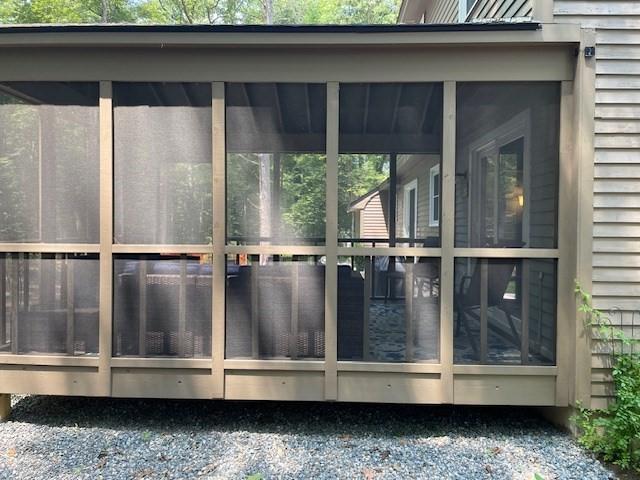 exterior space featuring a sunroom