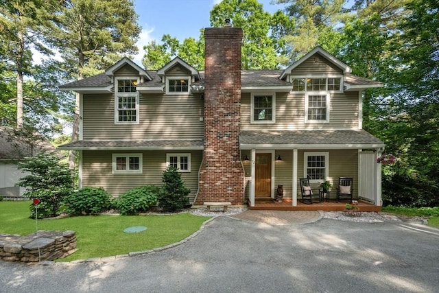 72 S Shore Dr, Sturbridge, MA 01566 - view of front of property featuring a chimney, covered porch, and a shingled roof