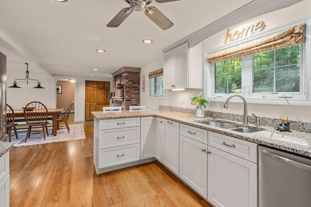 72 S Shore Dr, Sturbridge, MA 01566 - kitchen with dishwasher, a sink, a peninsula, ceiling fan, and light wood-style flooring