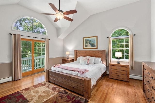 72 S Shore Dr, Sturbridge, MA 01566 - bedroom with a baseboard heating unit, access to outside, vaulted ceiling, light wood-style flooring, and a baseboard radiator