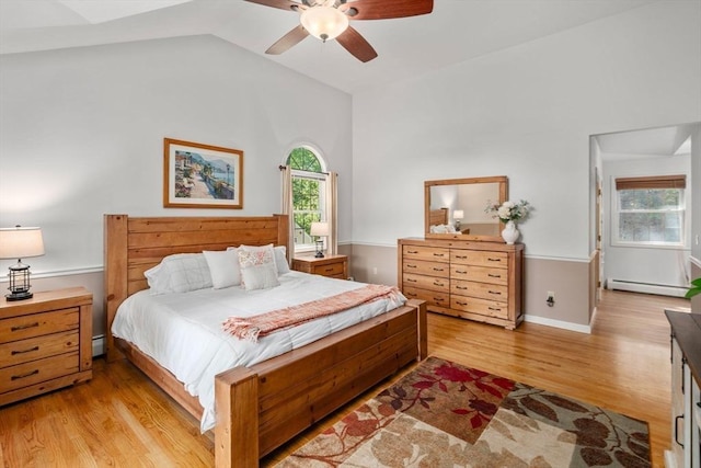 72 S Shore Dr, Sturbridge, MA 01566 - bedroom with a baseboard radiator, light wood finished floors, lofted ceiling, and ceiling fan