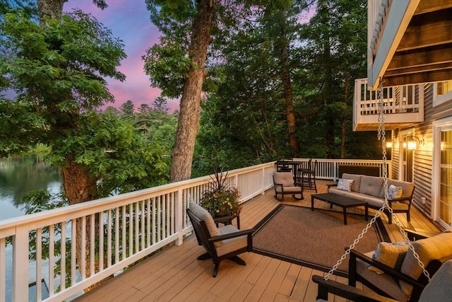 72 S Shore Dr, Sturbridge, MA 01566 - deck at dusk with outdoor lounge area and a water view