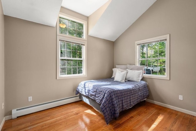 72 S Shore Dr, Sturbridge, MA 01566 - bedroom featuring a baseboard heating unit, wood finished floors, baseboards, and lofted ceiling